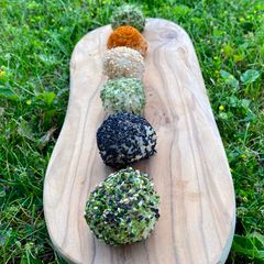 A picture of Japanese Brown Rice Balls with Seaweed and Seeds (and avocado, lime and wasabi filling).