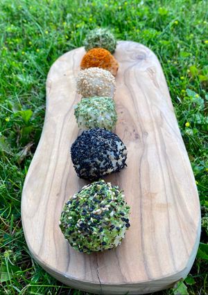 A picture of Japanese Brown Rice Balls with Seaweed and Seeds (and avocado, lime and wasabi filling).