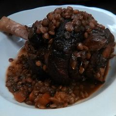 A picture of Lamb Shank w/ Lentils and Country Vegetables.