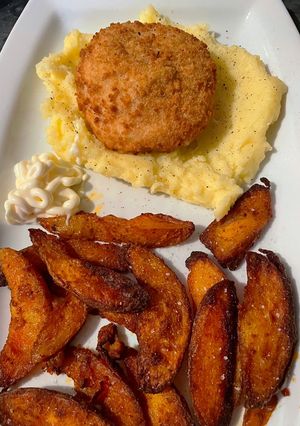 A picture of Garlic&herb Kiev on a bed of buttery mash & side of paprika wedges feed 2 for £3.