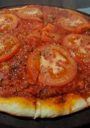 Una foto de Pizza a la cancha
