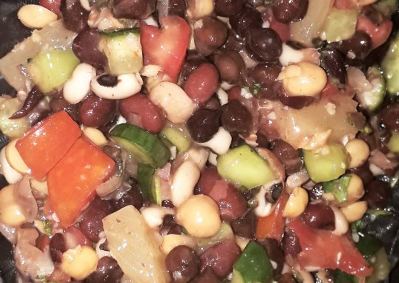 Veggies and fruits and beans and chickpea salad with lemon