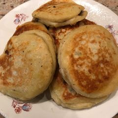 A picture of Potato cakes with cheese and mushrooms.