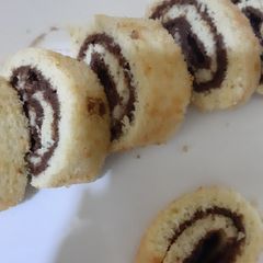 Chocolate vanilla Swiss roll in fry pan A picture of Chocolate vanilla Swiss roll in fry pan.