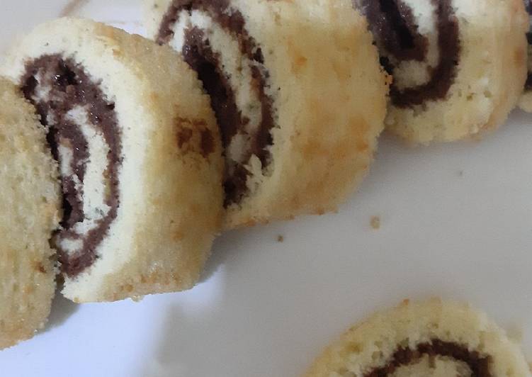 Chocolate vanilla Swiss roll in fry pan