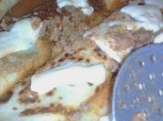 Una foto de canelones espinaca con picadillo