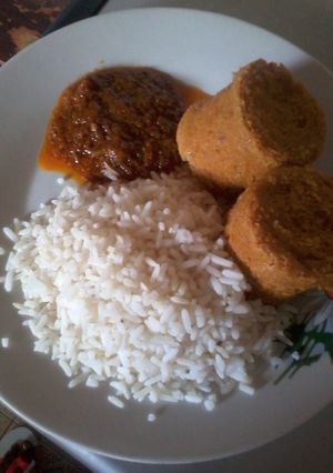 A picture of White Rice, Moi moi and Carrot Stew.