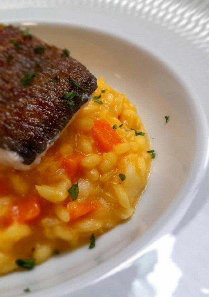 Una foto de Risotto de calabaza con bacalao