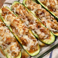 A picture of Stuffed Zucchini w/ homemade Sauce.