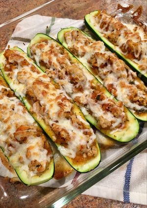 A picture of Stuffed Zucchini w/ homemade Sauce.