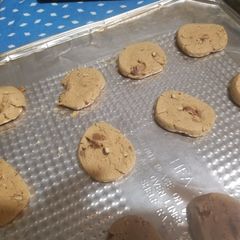 A picture of Peanut Butter Cookies with chocolate chips and walnuts.