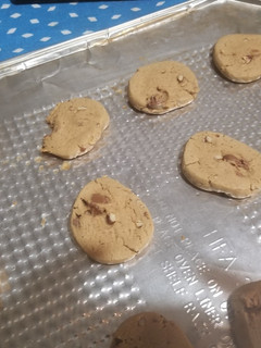 A picture of Peanut Butter Cookies with chocolate chips and walnuts.