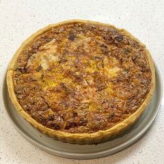 A picture of Broccoli and cheese quiche.