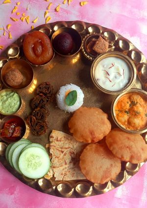 A picture of Maharashtrian Special Shrikhand Puri Thali.