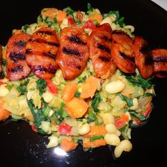 A picture of Braised white beans with spinach and grilled chorizo.