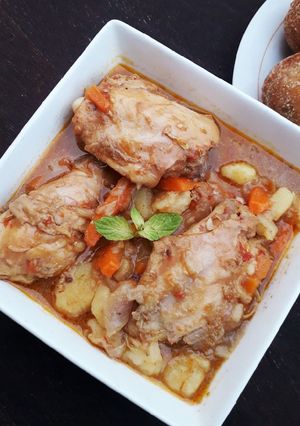 A picture of Hot carrot and potato chicken soup.