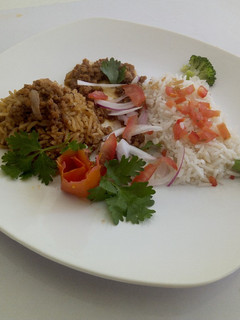 A picture of Chicken Pilau, minced meat with Vegetable rice.