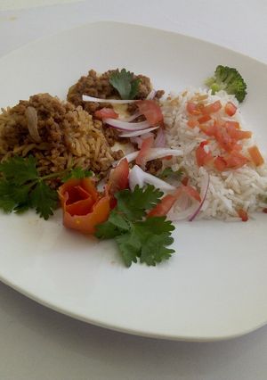 A picture of Chicken Pilau, minced meat with Vegetable rice.