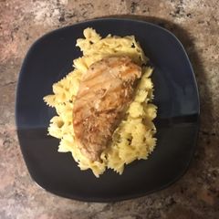 A picture of Teriyaki chicken served on Parmesan pasta.