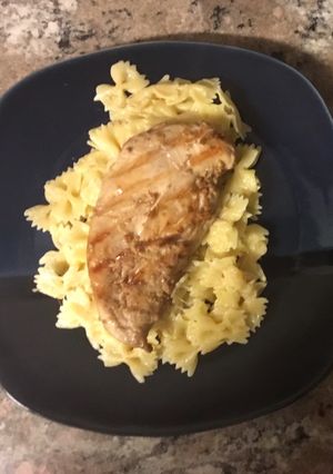 A picture of Teriyaki chicken served on Parmesan pasta.