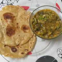 A picture of Visrati VangiTuria Pana Sabji with paratha.