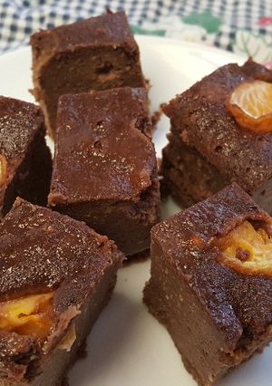 Una foto de Budin de pan dulce, chocolate almendra y mandarina