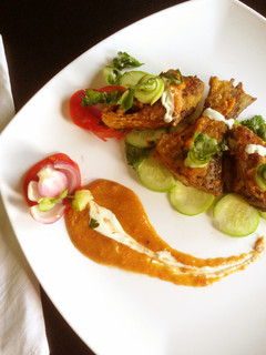 A picture of Ilish fish fry with spicy cream coconut sauce.