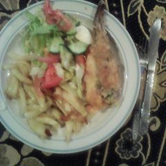 A picture of Fish & chips served with Green Salad.
