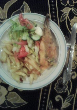 A picture of Fish & chips served with Green Salad.