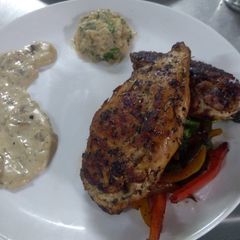 Stuffed chicken with cream mushroom sauce A picture of Stuffed chicken with cream mushroom sauce.