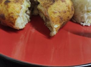 Una foto de Papas rellenas con pino y queso