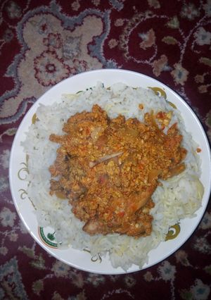 A picture of Rice with spag and egg sauce.