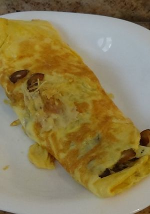 Una foto de Tortilla de boletus y queso