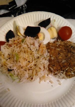 A picture of White rice with spring onion & sweet & smokey chicken breast.