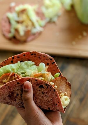 A picture of Chicken Tacos with Beetroot Paratha.