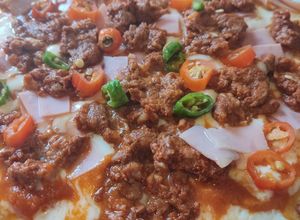Una foto de Pizza al sartén