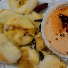 A picture of Andhra  Style Masala Potato  Stuffed  Idly.