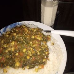 A picture of White rice and miyan alayyahu.