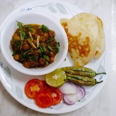 Pindi Chhole With Kulcha (Amritsari) A picture of Pindi Chhole With Kulcha (Amritsari).