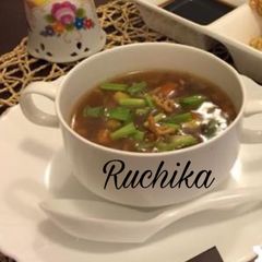 A picture of Hot and Sour Soup with fried Noodles.