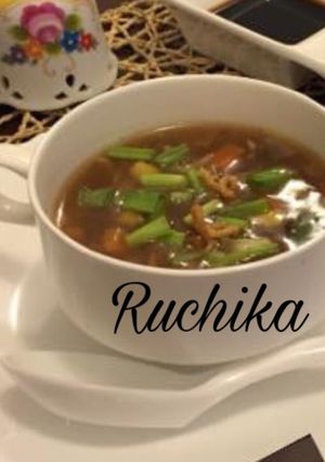 A picture of Hot and Sour Soup with fried Noodles.