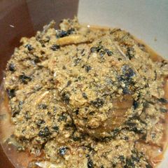 A picture of Egusi soup with fresh fish.