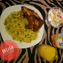 A picture of Fried rice, chicken and salad.