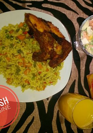 A picture of Fried rice, chicken and salad.