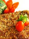 Milanesas estilo peruanas a la chapa con buñuelos de acelga y tomates cherrys