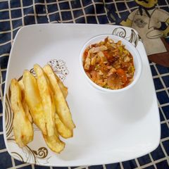 A picture of Sweet potatoes and cabbage sauces.