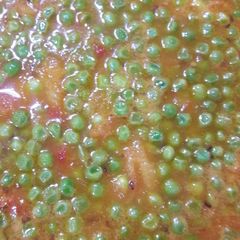 A picture of Restaurant style curries MATTAR in tomato gravy.