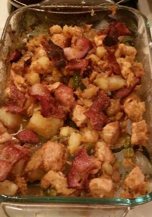 A picture of cincy style chicken and potato extravaganza .