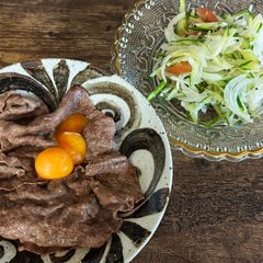 A picture of Japanese Wagyu Beef with Egg yolk.