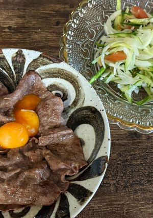 A picture of Japanese Wagyu Beef with Egg yolk.